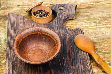 Clay bowl and a wooden spoon.
