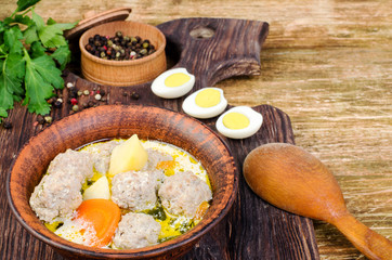 Soup with meatballs and vegetables.