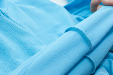 at a garment factory quality control check for defects