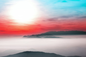 Beautiful landscape view with colorful cloudscape and sun.