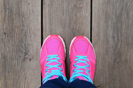 Pink Sport Shoe On Wood Slat Floor