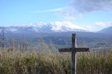 Isolated wooden cross on the mountain