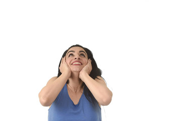 Fototapeta premium young beautiful hispanic woman looking up to blank copy space surprised