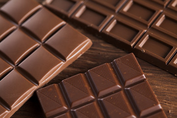 Chocolate bar, candy sweet, dessert food on wooden background
