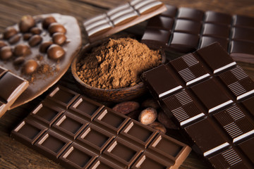 Chocolate bar, candy sweet, dessert food on wooden background