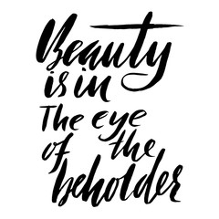 Beauty is in the eye of the beholder. Hand drawn lettering proverb. Vector typography design. Handwritten inscription.