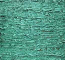 Fototapeta premium Aged wooden surface. With cracked cold green paints. Abstract retro background.