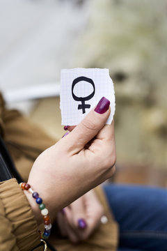woman with a female gender symbol