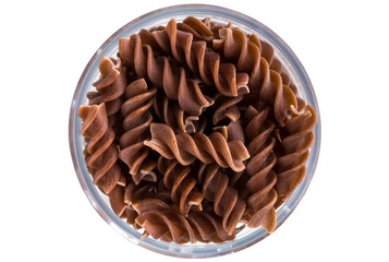 Background of colorful pasta texture close-up. Assortment of colorful macaroni. italian pasta. Variety of types and shapes of dry Italian pasta. Full background of dry uncooked macaroni.