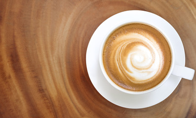 Top view of hot coffee cappuccino on wood table background
