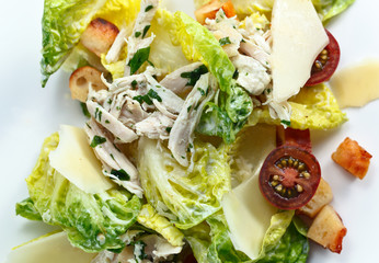Caesar salad with tomatoes ,toasts  and chicken