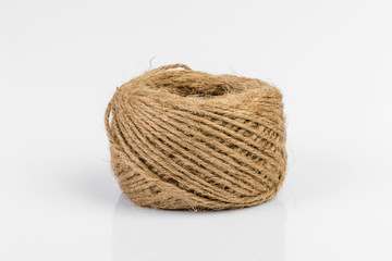 Obraz premium Skein of jute twine isolated on white background.