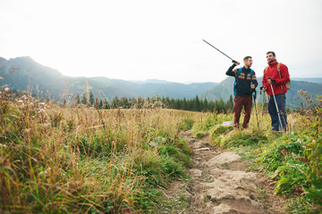 Friends talking together while out for a hike