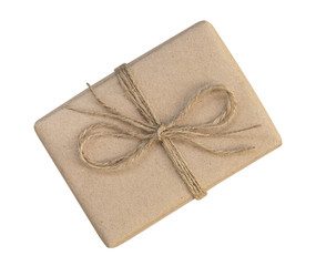 Gift box wrapped in brown recycled paper and tied sack rope top view isolated on white background, clipping path included