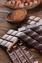 Chocolate bar, candy sweet, dessert food on wooden background