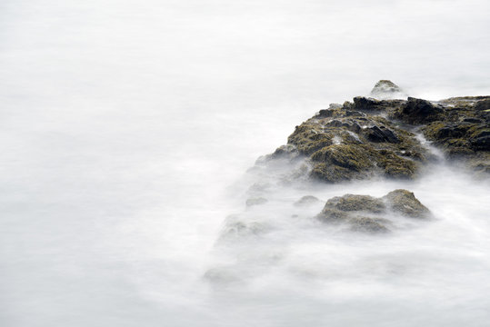 Ocean Waves Over Rocks at Cliff Walk in Rhode Island