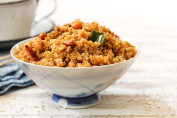 Quinoa Puliyogare or Puliyodharai served in a bowl, selective focus