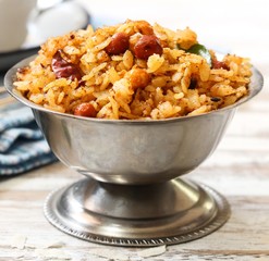 Tamarind Poha / Puli Aval - South Indian breakfast with flattened rice, selective focus