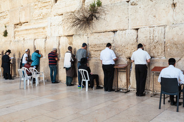 The Western wall or Wailing wall in the old city of Jerusalem, Israel. Jews pray at the wall of the...