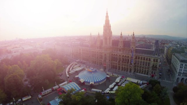 Vienna City Council, sun flare beauty aerial shot of Rathaus in Europe Austria capital, world tourist attraction in historic place, government and mayor residence, famous building worth seeing
