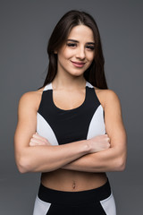 Portrait of a beautiful fitness woman with crossed arms