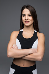 Fototapeta na wymiar Portrait of a beautiful fitness woman with crossed arms