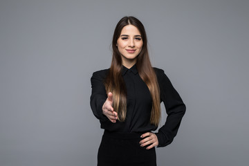 Portrait of young cheerful beautiful business woman giving hand for handshake