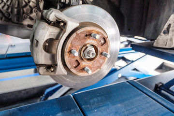 Car take wheel off show drum brake assembly. changing tire.