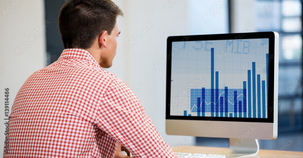 Poster man using desktop computer displaying a graph chart on screen