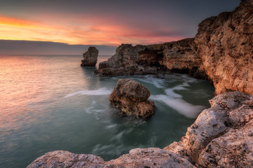 Sea rocks at sunrise /
Long exposure sea sunrise at the rocky Black sea coast near Tulenovo, Bulgaria