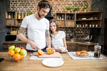 Man cutting orange
