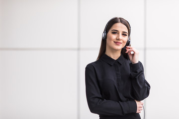 Portrait of smiling cheerful customer support phone operator in headset
