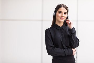 Portrait of smiling cheerful customer support phone operator in headset