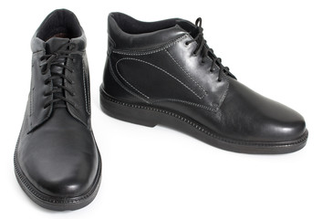 Pair of black mens leather winter boots isolated on a white background