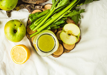 green detox juice with apple, kale, lemon and celery