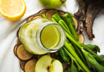 green detox juice with apple, kale, lemon and celery