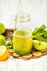 green detox juice with apple, kale, lemon and celery