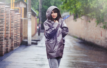 Fototapeta premium happy woman walking in the rain