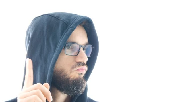 Closeup of negative refusing bearded man in hoodie shaking his head and gesturing with finger, isolated on white background.