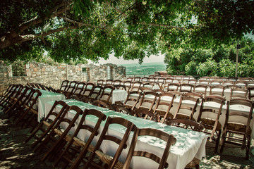 Many empty chairs waiting as background