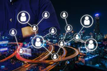 double exposure of man crossing arms and social media network connection concept on night city background, color tone effect.