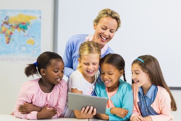Teacher and kids using digital table