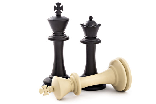 Chess business concept, leader & success. Black king and queen above defeated white king