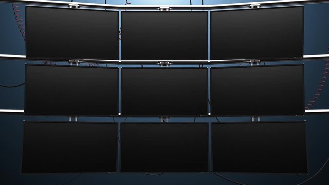 Zoom In to Nine Blank Video Screens. camera zooms in on nine blank monitor screens mounted on a wall with cables. Has green and matte for placing in your own images.

