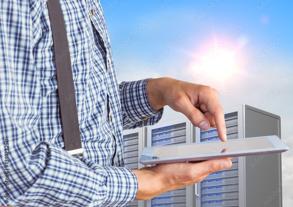 Poster man using digital tablet against office building in background