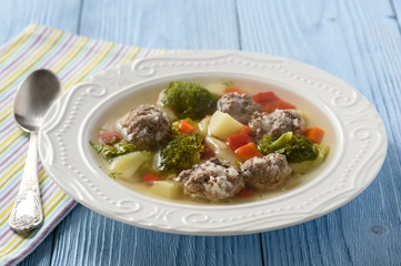 Clear soup with vegetables and beef meatballs.