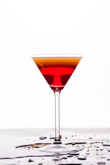 Cocktail drink on white background, water drops on the table. Space in background for copy, text, your words