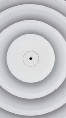 Close up circle air grill on ceiling.