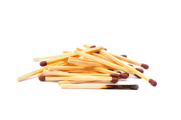 Laid used matchsticks isolated on white background