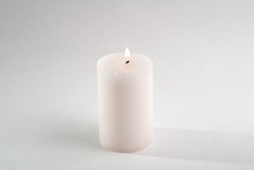 Fototapeta na wymiar the white candle on white background,